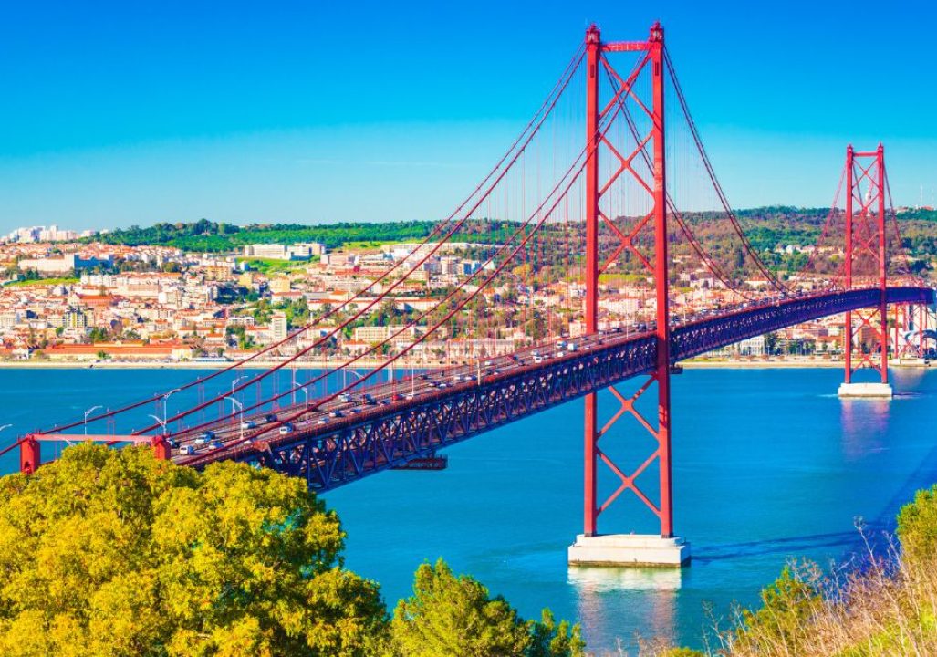 The 25th April Bridge (Ponte 25 de Abril) in Lisbon, Portugal. View from Almada