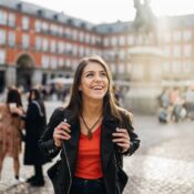 Young travel woman sightseeing urban outdoors.