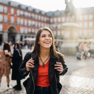 Young travel woman sightseeing urban outdoors.