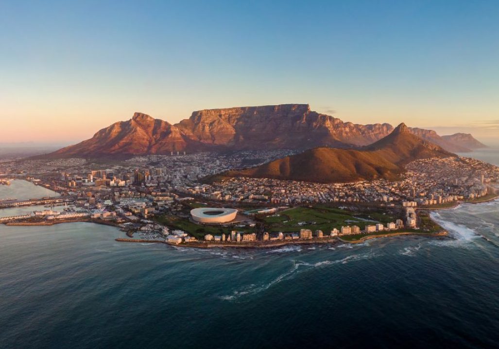 Aerial panoramic view of Cape Town cityscape at sunset, Western Cape Province, South Africa.