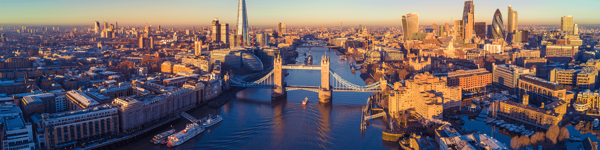 United Kingdown, aerial view of the River Thames with the iconic Tower Bridge prominently in the foreground.