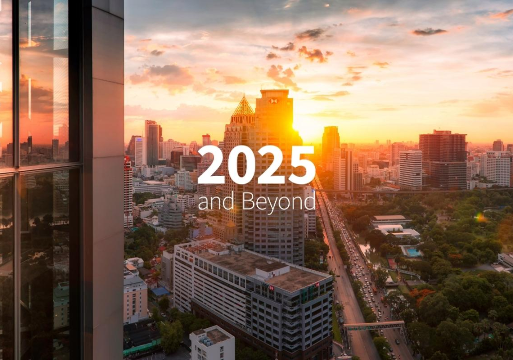 City skyline at sunset with tall buildings, lush trees, and a bustling road. Text reads 