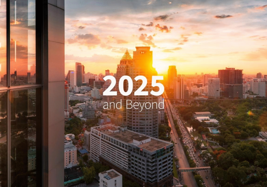 City skyline at sunset with tall buildings, lush trees, and a bustling road. Text reads