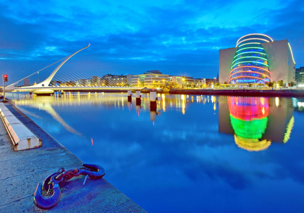 Samuel Beckett Bridge, a harp-shaped cable-stayed bridge spanning the River Liffey, and the Convention Centre Dublin, Ireland.