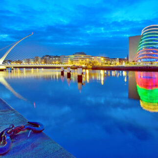 Samuel Beckett Bridge, a harp-shaped cable-stayed bridge spanning the River Liffey, and the Convention Centre Dublin, Ireland.