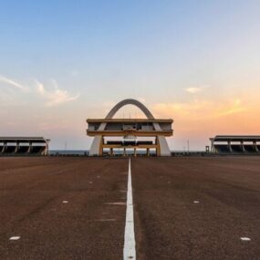 Wide shot of Independence Arch in Accra, Ghana during sunset.