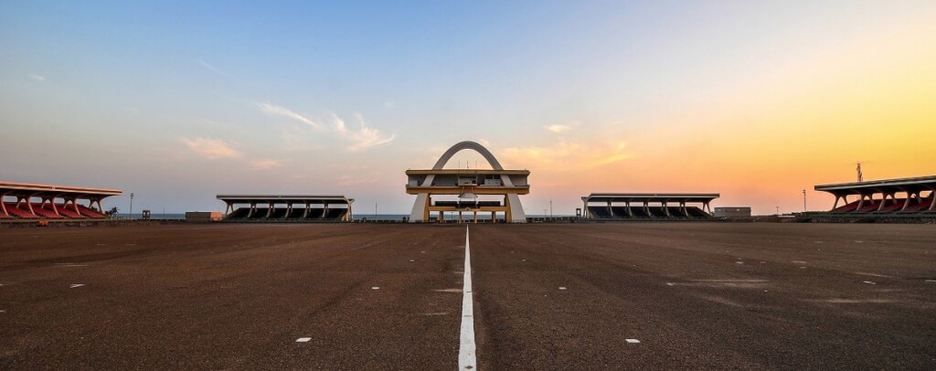 Wide shot of Independence Arch in Accra, Ghana during sunset.