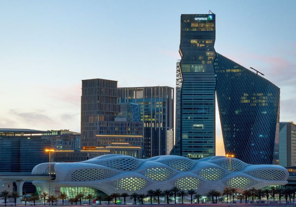 King Abdullah Financial District Metro Station in Riyadh with the cityscape in the background.