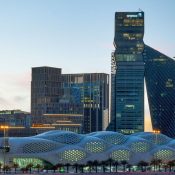 King Abdullah Financial District Metro Station in Riyadh with the cityscape in the background.