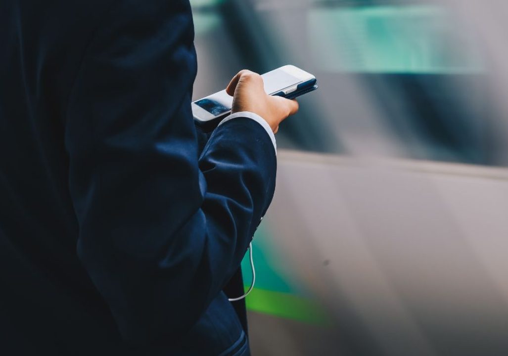 Business man on his mobile device.