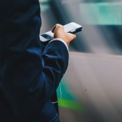 Business man on his mobile device.