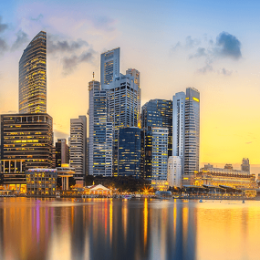 Singapore business district skyline during sunset.