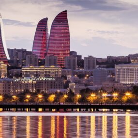 View of the waterfront and the city at night, in Baku, Azerbaijan. vintage tone filter
