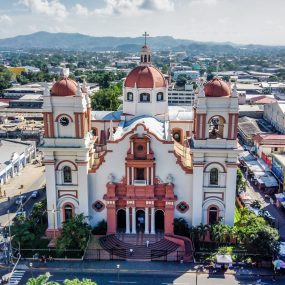 Metropolitan Cathedral of Saint Michael the Archangel in Tegucigalpa, Honduras featuring colonial architecture and twin bell towers with reddish domes.