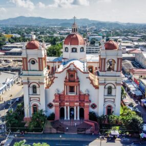 Metropolitan Cathedral of Saint Michael the Archangel in Tegucigalpa, Honduras featuring colonial architecture and twin bell towers with reddish domes.
