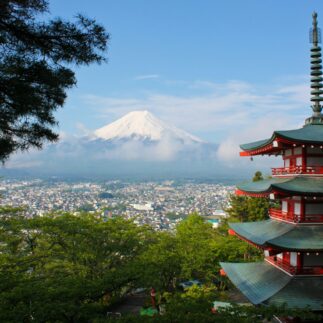 view of historical building in Japan with Mount Fuji in the background
