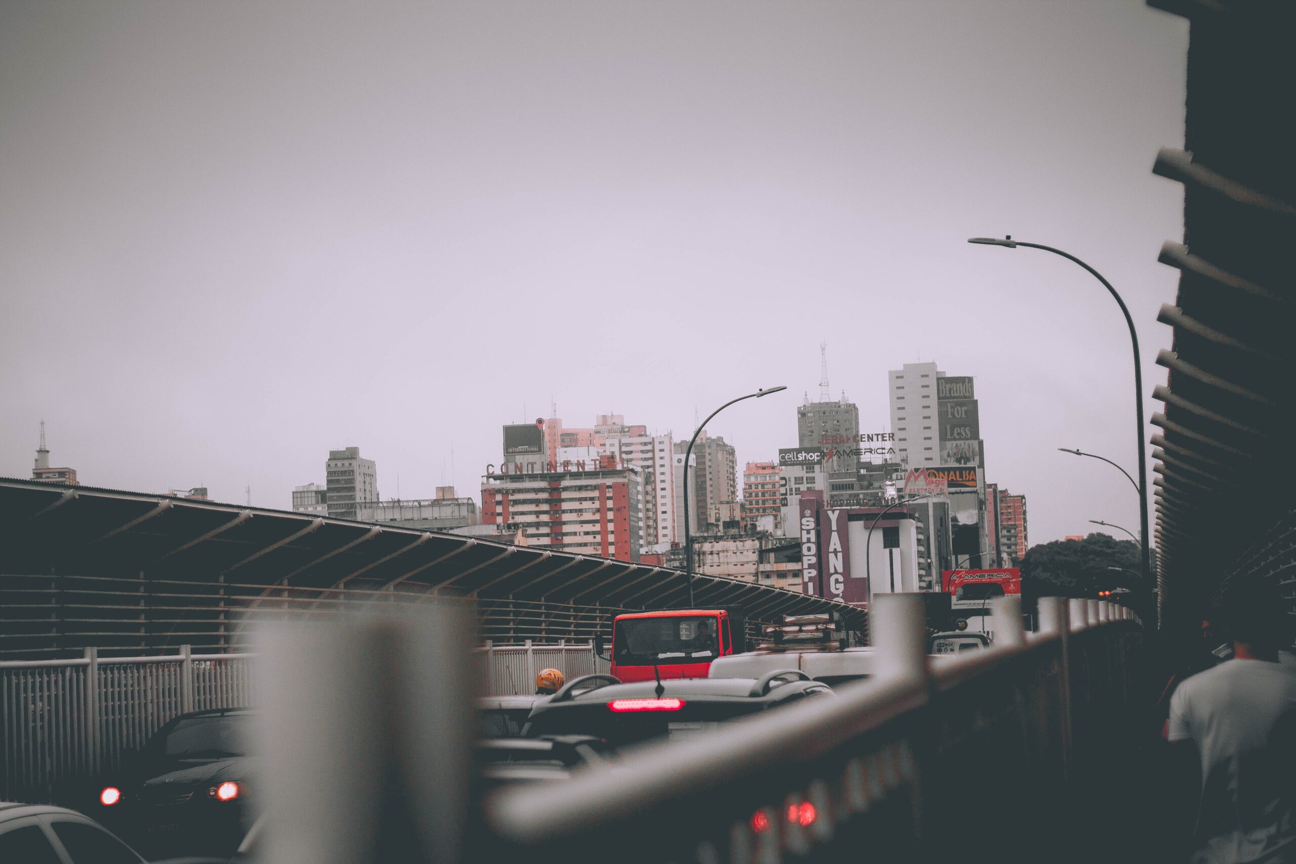 a Paraguay cityscape with numerous buildings and traffic on a highway or overpass