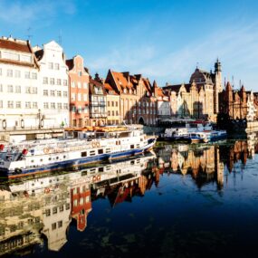 Poland, It features a picturesque waterfront with colorful, historic buildings, often referred to as 