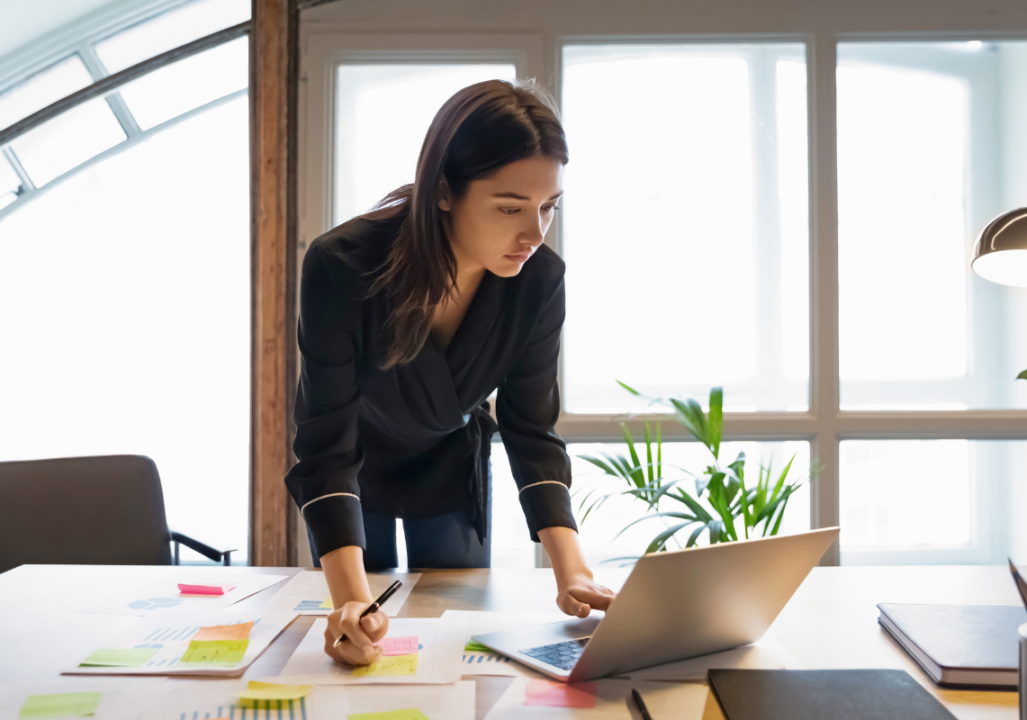 Professional woman works alone in a conference room