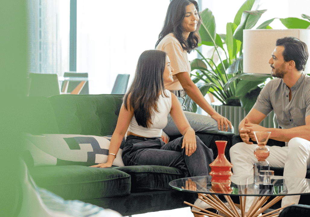 Three colleagues in relaxed office setting