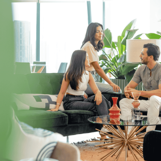 Three colleagues in relaxed office setting