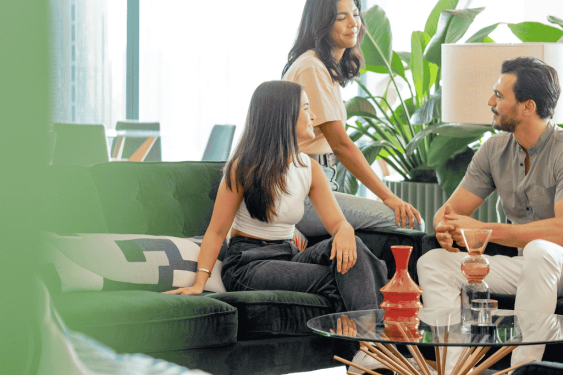 Three colleagues in relaxed office setting