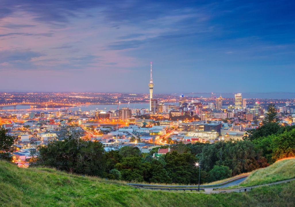 Cityscape image of Auckland skyline, New Zealand taken from Mt. Eden at sunset.