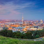Cityscape image of Auckland skyline, New Zealand taken from Mt. Eden at sunset.