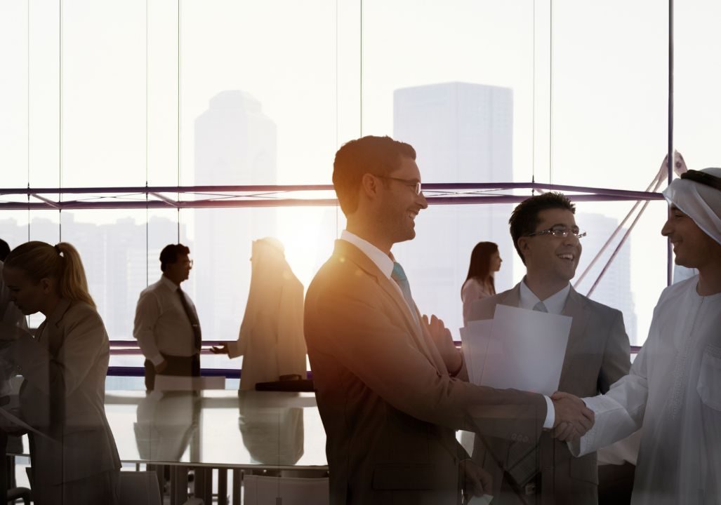 Professionals chat after meeting