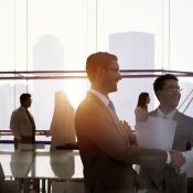 Professionals chat after meeting