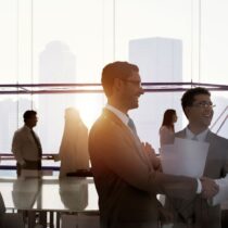 Professionals chat after meeting