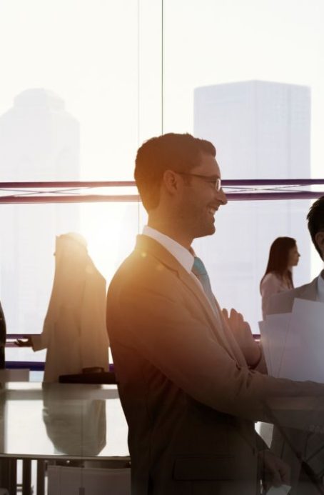 Professionals chat after meeting