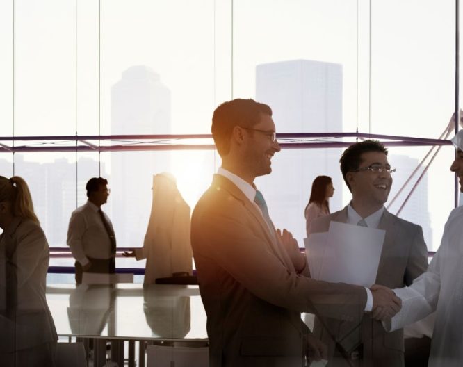 Professionals chat after meeting