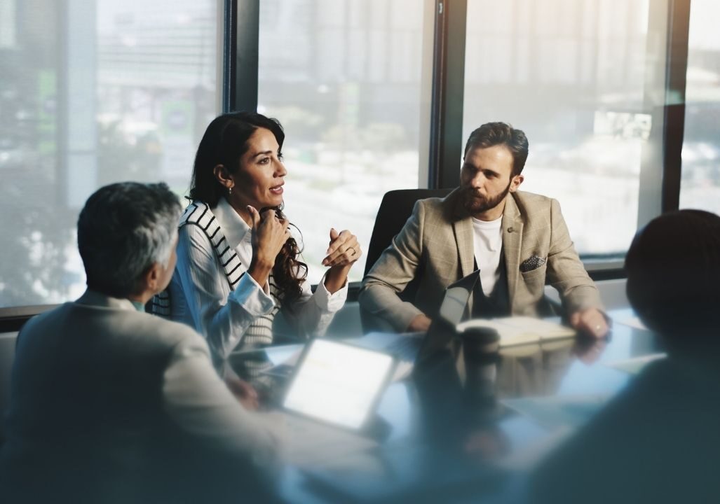 Meeting, woman in collaboration with colleagues, boardroom